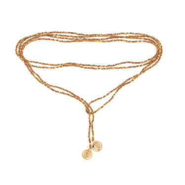 Collar enredable mostaza detalles dorado.